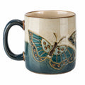 Mug en céramique bleu avec papillon en relief