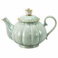 Théière en porcelaine vert avec détails dorés